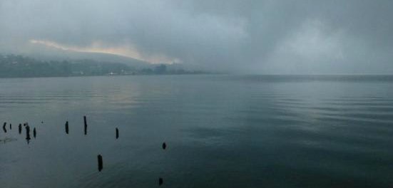 Mist over a lake.  Sad and moody expressing grief.